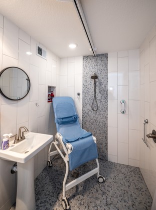 Tiled roll-in shower installation.