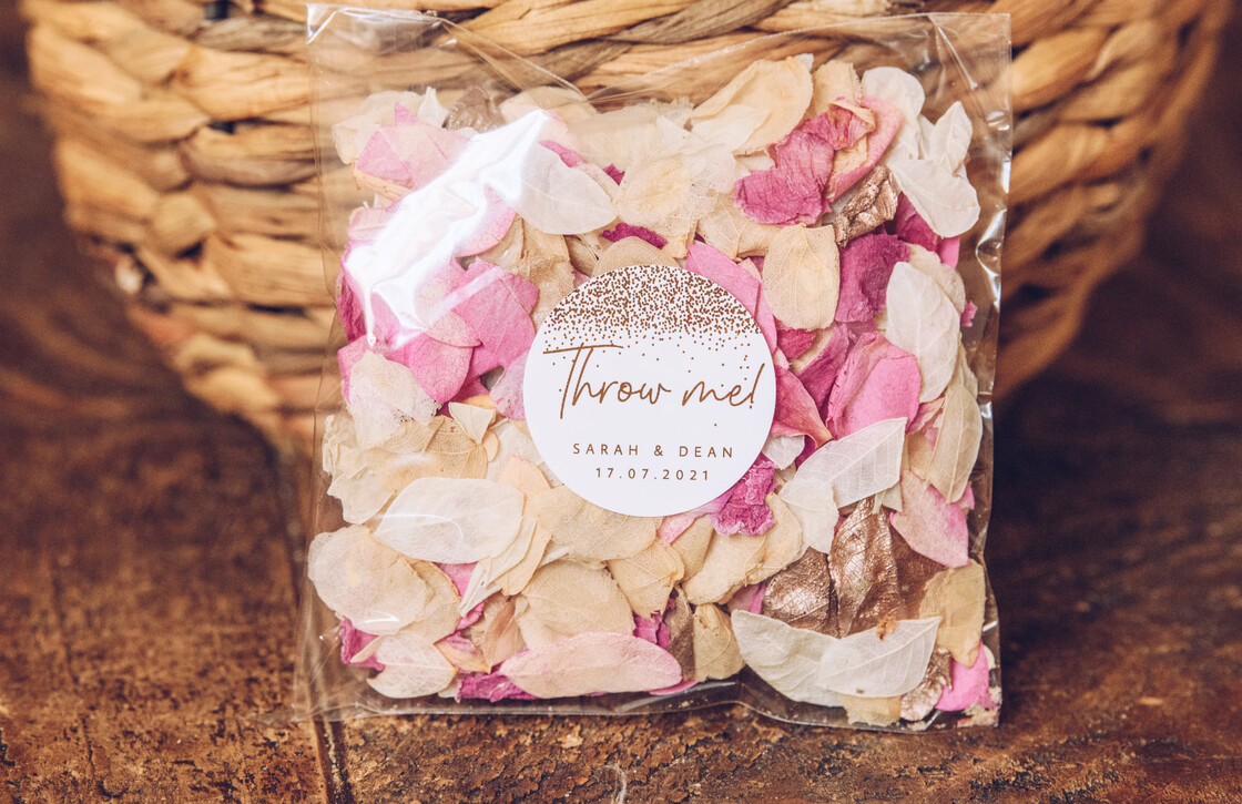 why do we throw confetti at weddings