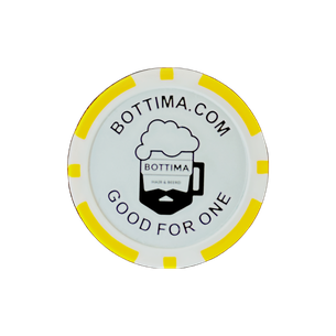 A glass of beer with a straight razor next to it.