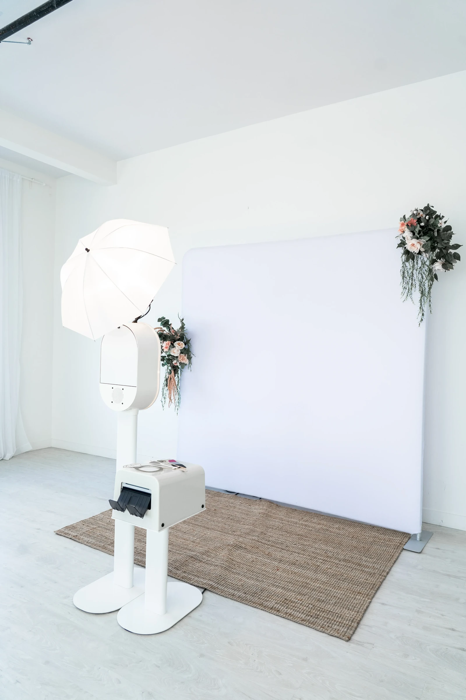 Open-air DSLR photo booth setup with white backdrop for an elegant Virginia Beach wedding.