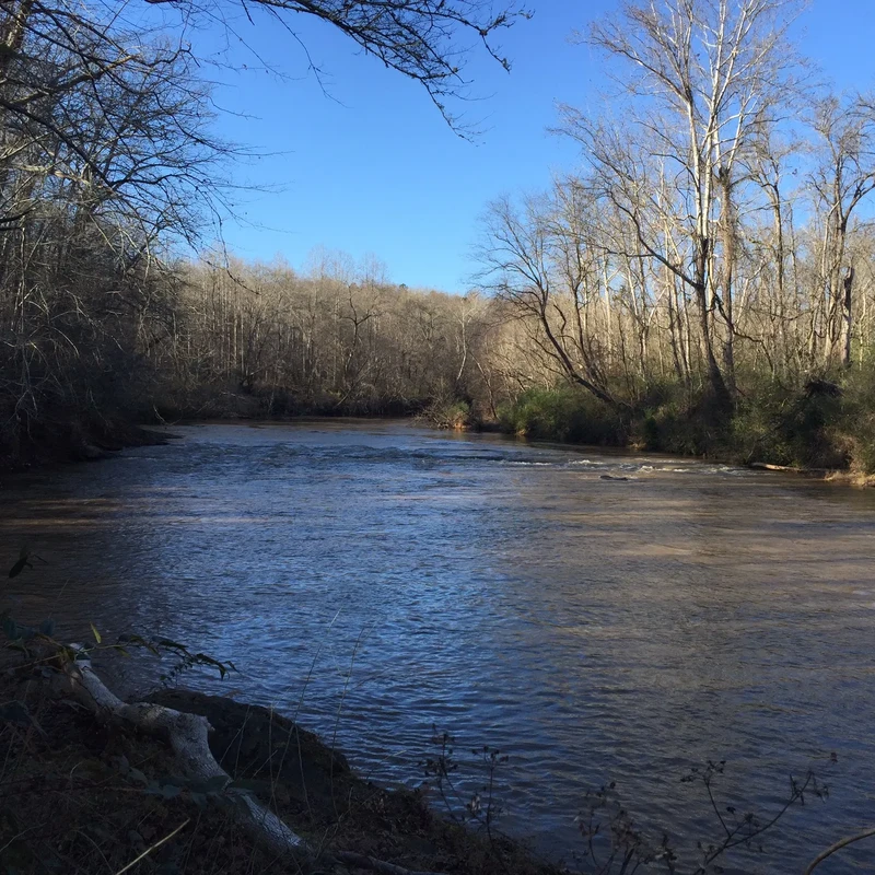 Peaceful winter view of the Pacolet River with clear blue skies, showing the year-round beauty of the riverfront property