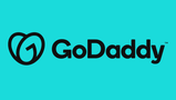 The GoDaddy logo, displayed in blue-green colors, is prominently featured on the website. It consists of the company name in stylized text with a curved underline. GoDaddy is a website hosting and domain registration company and a client of Paul Filek