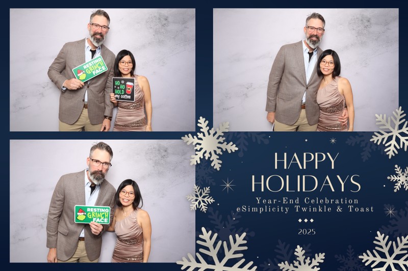 Two guests posing together in a holiday photo booth setup with festive props, displayed alongside a 