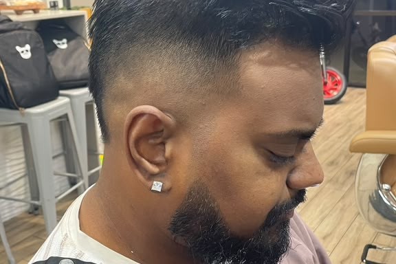 Sharp and stylish—fade and beard by Barber Boris, only at Bottima Barbershop.