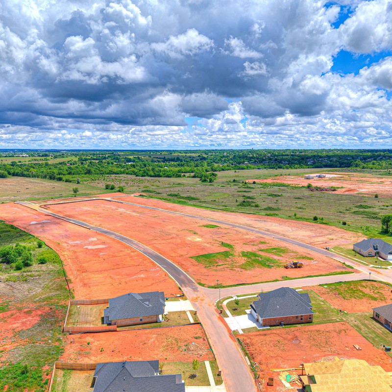Expansive drone view of Canyon Ridge Phase 2 in Mustang OK featuring available custom home lots.