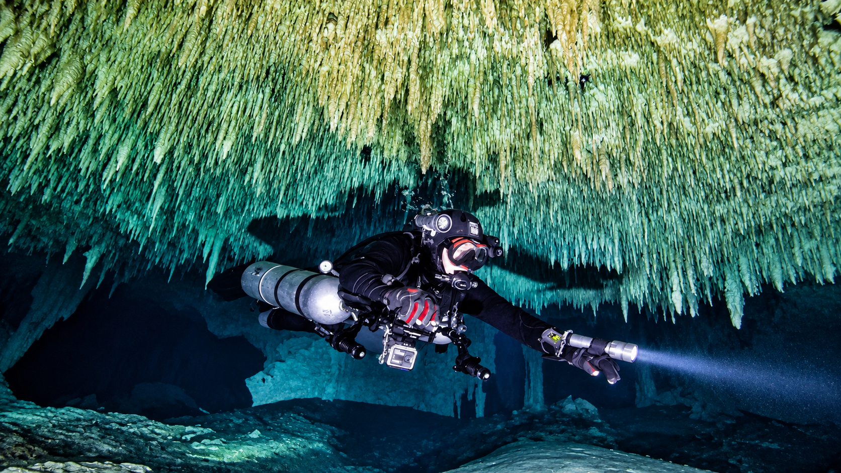 Technical divers in a cave environment