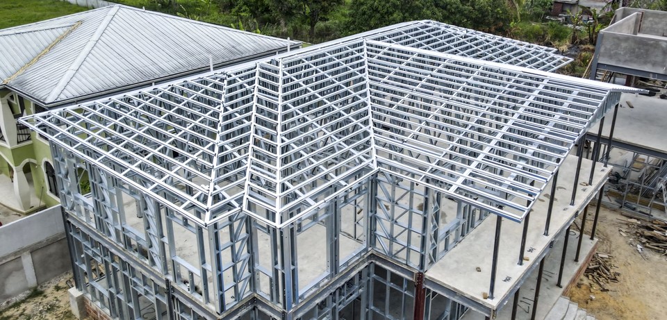 Aerial overhead shot showing the steel framed structure of a new house in development.
