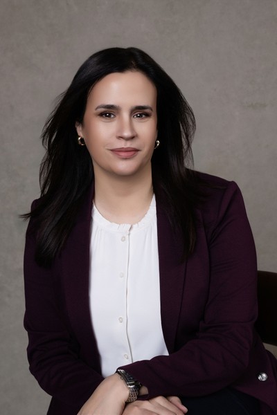 Alison Migneault, Founder of Kind Strategy smiles at the camera.