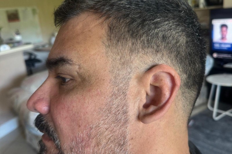 Barber Boris showing precision with this classic gentleman’s fade and detailed beard at Bottima.