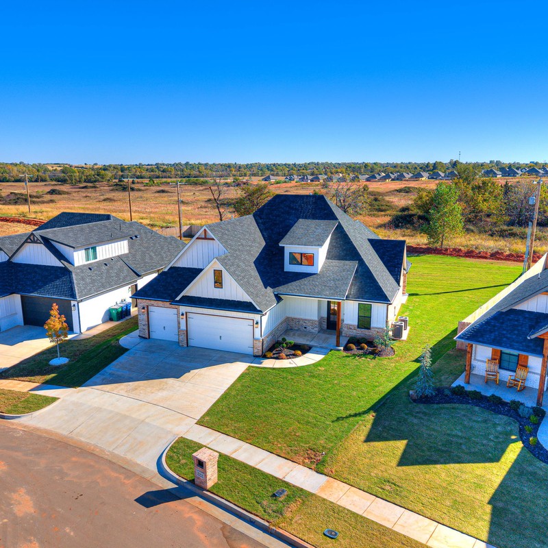 Overhead neighborhood view highlighting 10408 SW 51st Street Mustang OK and nearby new builds in the development.