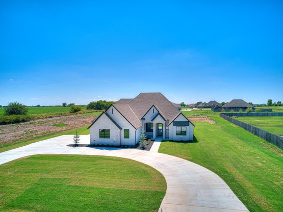 The Marquez Custom Home showcases a 2,995 sq. ft. layout with four bedrooms, a study, and a spacious game room. Built on a two-acre property in Mustang, OK, this home features a custom-built bar tap in the office and reflects the quality craftsmanship Merryfield Homes is known for.
