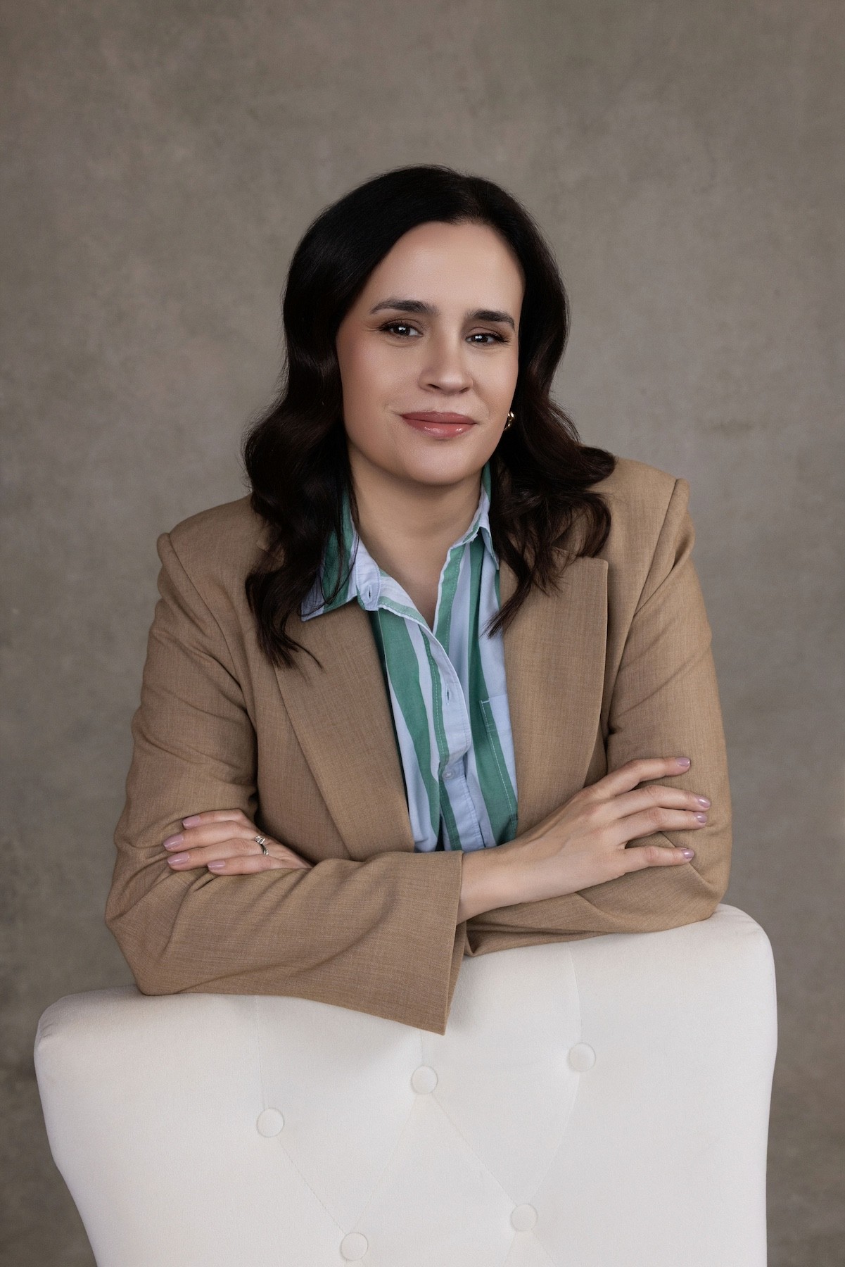 Alison Migneault, Founder of Kind Strategy smiles.