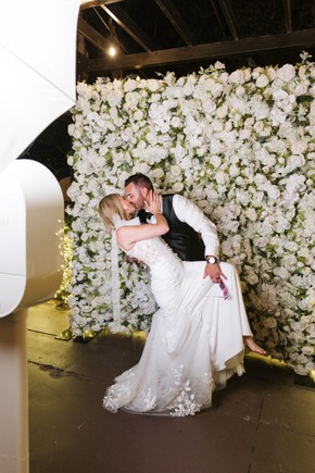 DSLR photo booth rental in irvine, california with a flower wall