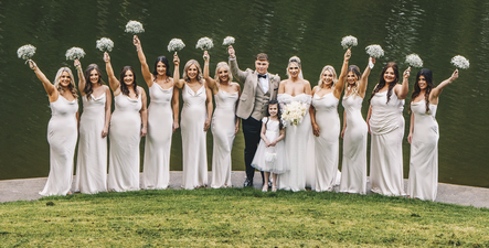 Bridal party celebrating together at Canada Lakes in the Vale of Glamorgan, South Wales. The peaceful lake, lush greenery, and natural light create a stunning backdrop for joyful and cinematic wedding photography.
