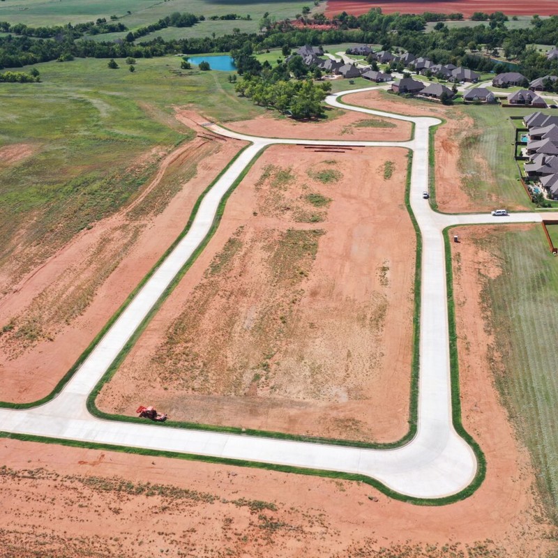 Aerial drone photo of Spitler Lake Estates Section 3 available lots for custom homes in Mustang OK.