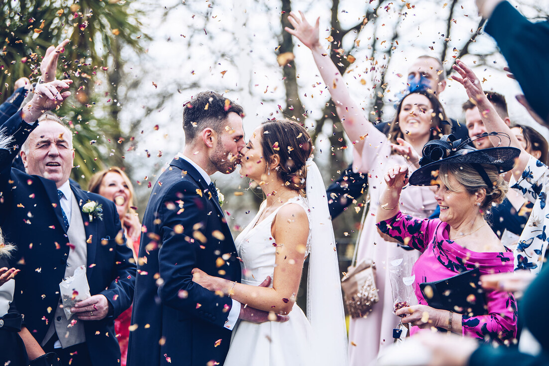 why do we throw confetti at weddings