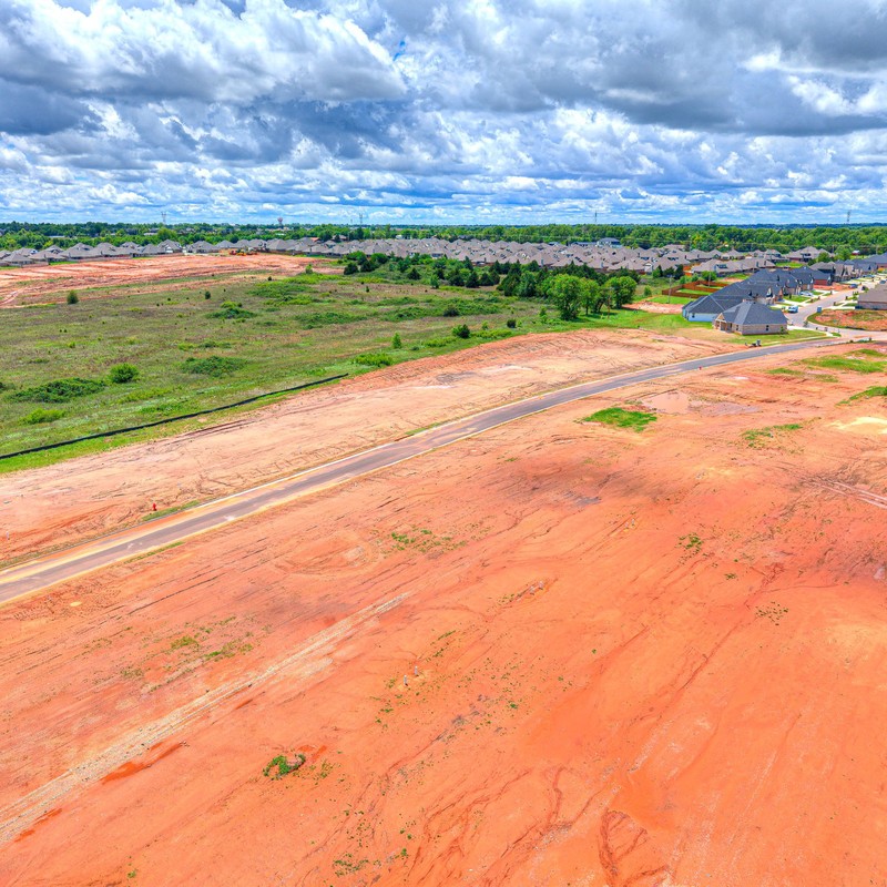 Aerial drone view of Canyon Ridge Phase 2 in Mustang OK showing newly developed custom home lots.