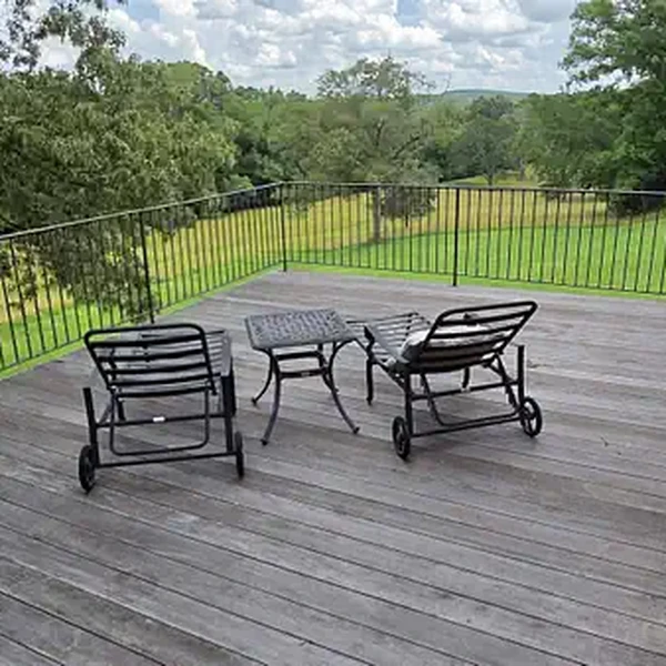 Spacious deck overlooking the property grounds, ideal for outdoor meetings, fellowship, and enjoying God's creation
