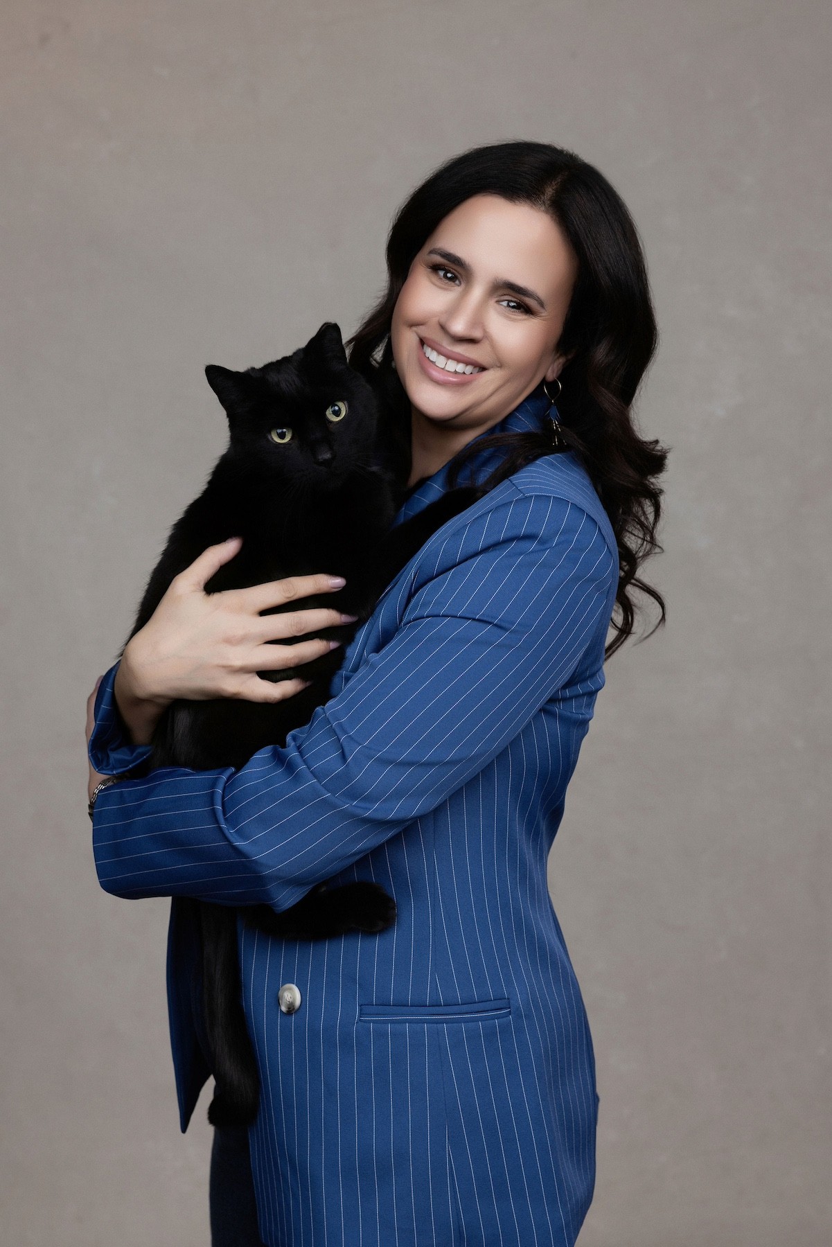 Alison, Founder of Kind Strategy, with her black cat, Kevin Bacon, adopted from Kingston Animal Rescue.