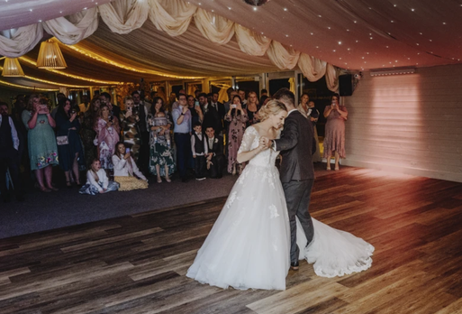 Evening wedding photography capturing natural first dance moments in South Wales.
