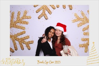 uests wearing Santa hats at Chesapeake holiday photo booth.