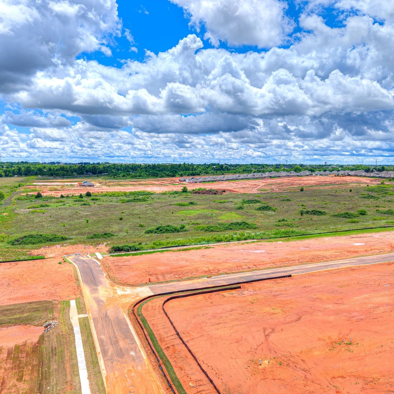 Canyon Ridge Phase 2 aerial view of available custom home lots and surrounding green space in Mustang OK.