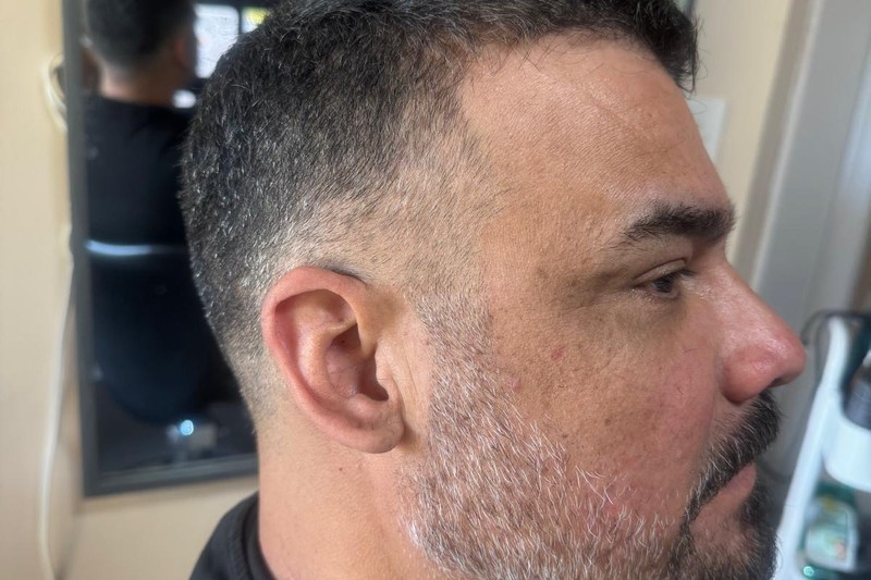 Barber Boris showing precision with this classic gentleman’s fade and detailed beard at Bottima.