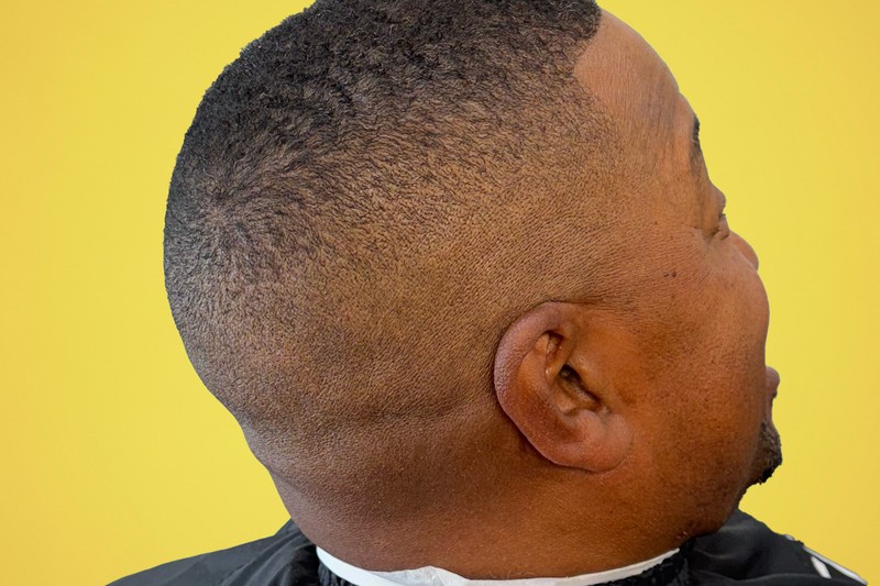 Barber Boris showing precision with this classic gentleman’s fade and detailed beard at Bottima.