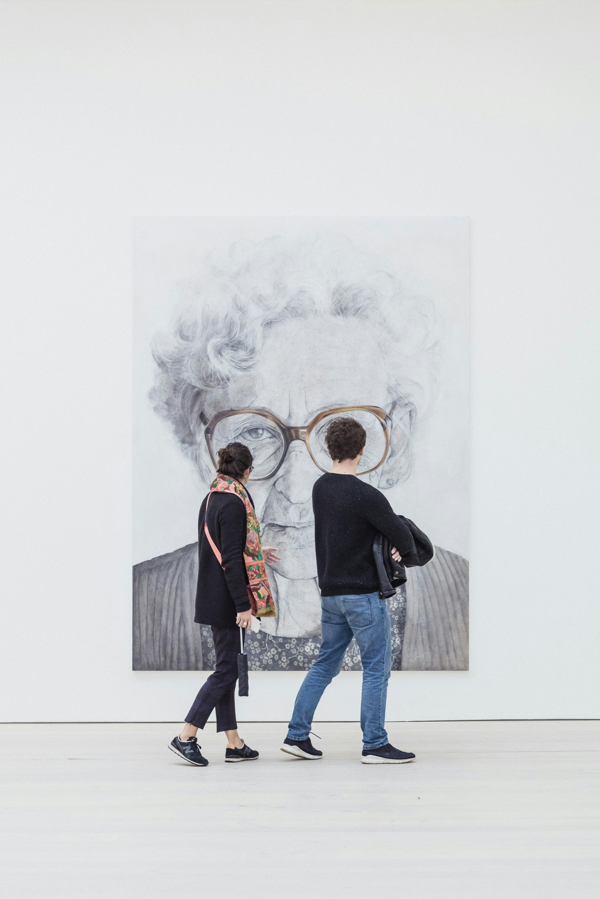 Two people look at a painting of a women.

Photo by Ryan Stefan on Unsplash