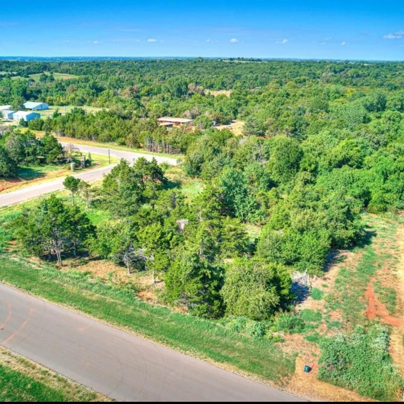 Aerial drone view of the last remaining corner lot in Highland Estates, Mustang Oklahoma, available for a custom home build.