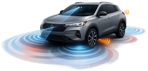 Vehicle showing ADAS systems including front camera, radar, and blind-spot sensors used for safety calibration