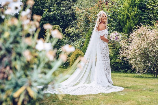 wedding dress photography in the garden during bridal preperations