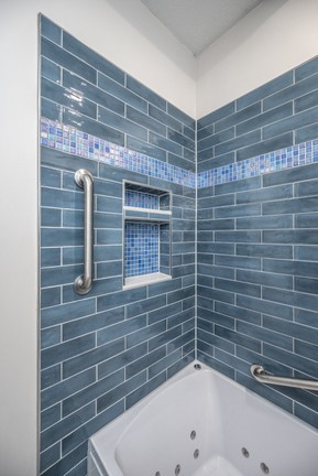 Tiled wall with grab bars